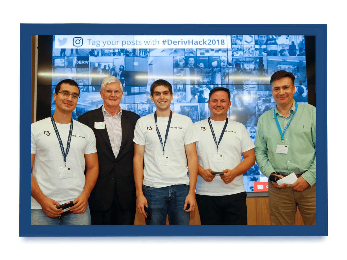 A team of five professionals, with four members from R3:INDUSTRIA, at the DerivHack2018 event.